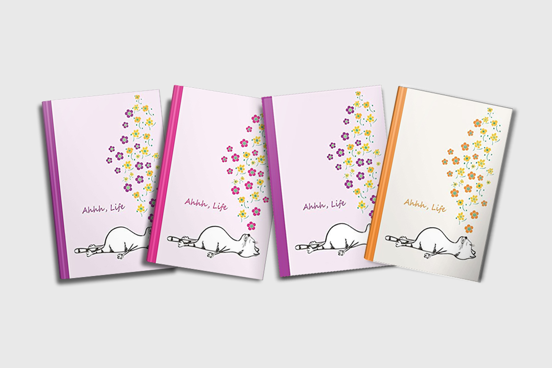 A set of four colorful cat journals featuring a napping or sleeping tabby cat . Text says "Ahhh, Life" and there are flowers above the cats sleeping form. There are four colors shown: purple, pink orange and blue.