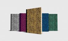 Five animal print journals in a variety of colors.