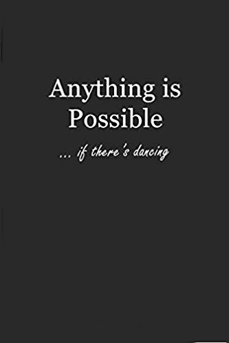 Black journal with white text that says: Anything is Possible... if there's dancing