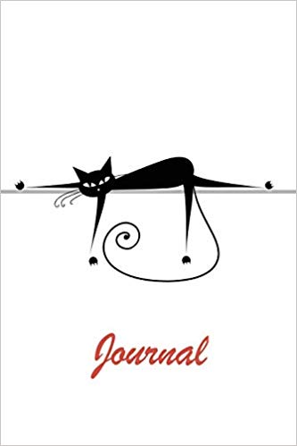 White softcover notebook with a black cat lounging on a shelf. Red text says journal.