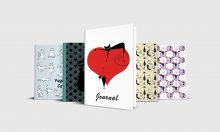 Five journals with different cat covers. Yoga Cats in light blue, Art Deco Cats in teal blue, Cats Playing with Butterflies in yellow, Cats in Circles in purple, and Cats on a Heart in red and white.