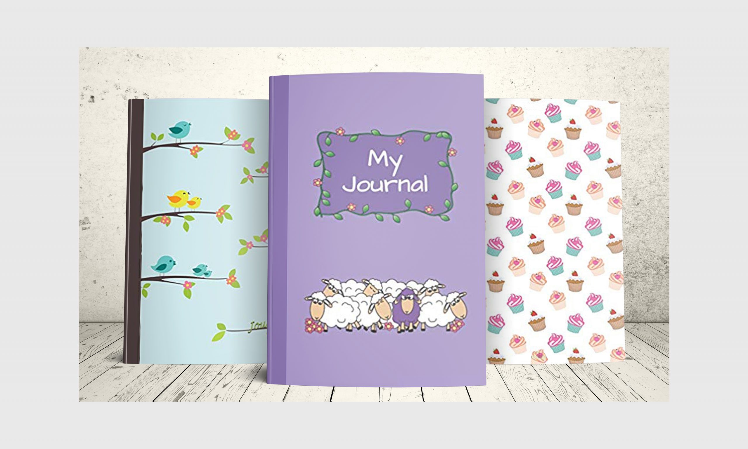 Three journals with covers that appeal to children: Singing Birds (cute cartoon birds singing on tree branches), My Journal (cute sheep cartoon) and I Love Cupcakes (colorful cartoon images of cupcakes)