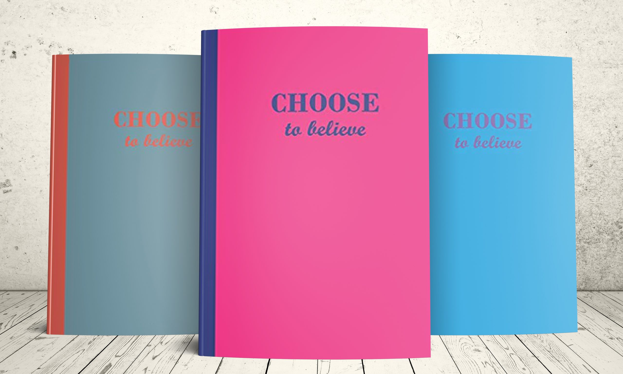 Three journals with the motivational phrase Choose to believe on the cover: blue cover with orange text, pink cover with blue text, blue cover with purple text.