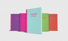 Five colorful notebook journals with the words Choose to believe on the cover. Covers in Blue and pink, purple and pink, green and orange, orange and green.