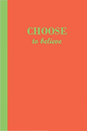 Orange journal with the motivational phrase Choose to believe in light green text.