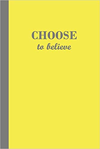 Yellow journal with the motivational phrase Choose to believe in grey text.