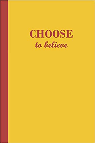 Yellow journal with the motivational phrase Choose to believe in red text.