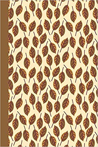 Writing journal with cream background and gold and brown leaves.