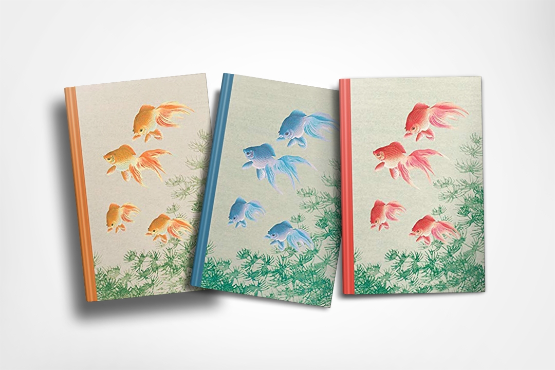 Three journals with koi fish on the cover (gold, blue and orange).