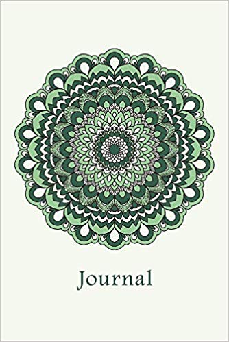 Notebook with green mandala and the word journal on the cover