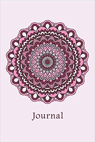 Notebook with pink mandala and the word journal on the cover