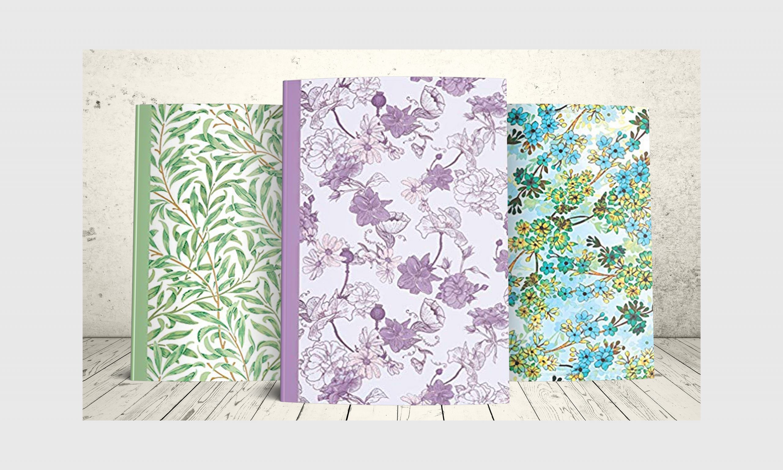 Three journals with floral designs.