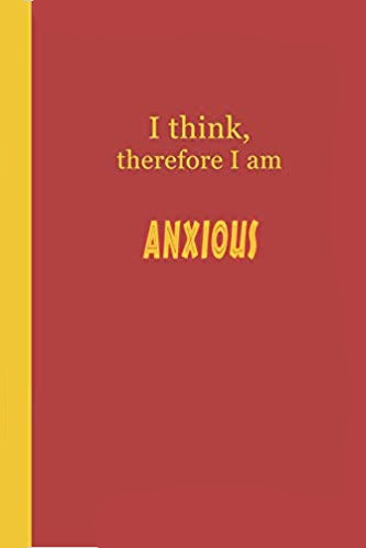 Red journal with yellow text that says I think, therefore I am anxious.