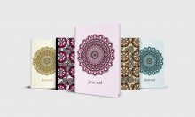 Five journals with mandalas on the cover