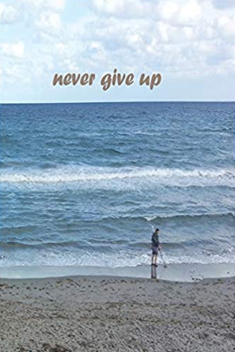 Journal cover with the image of a man on a beach with a metal detector. Gold text that says never give up.