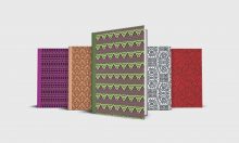 Five journals from Premise Content in different colors: purple, orange, green, blue and red.
