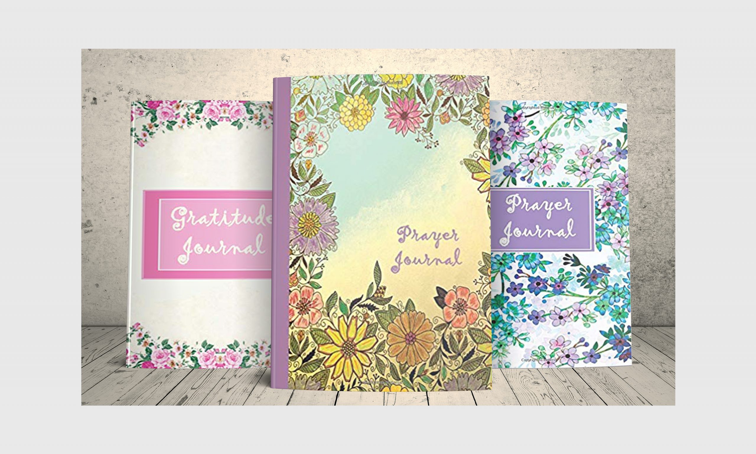 Three Prayer and Gratitude journal notebooks with floral design.