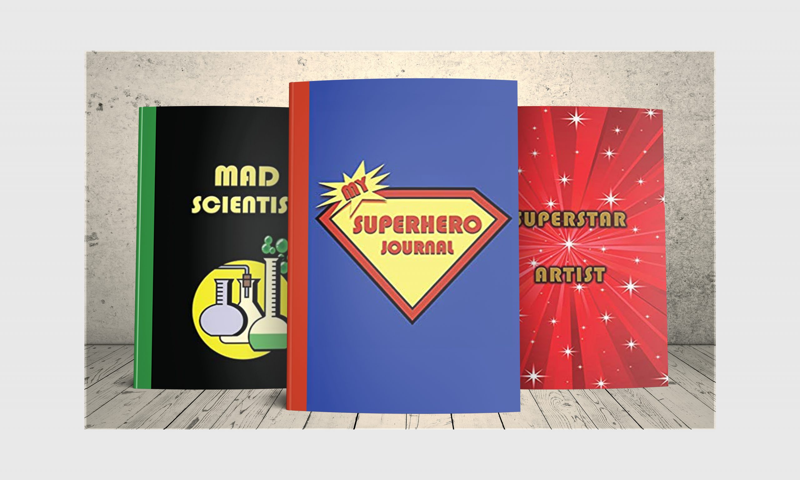 Three journals from Premise Content - My Superhero Journal in superman colors, Mad Scientist Journal in black, yellow and green and Superstar Artist in red with white stars.