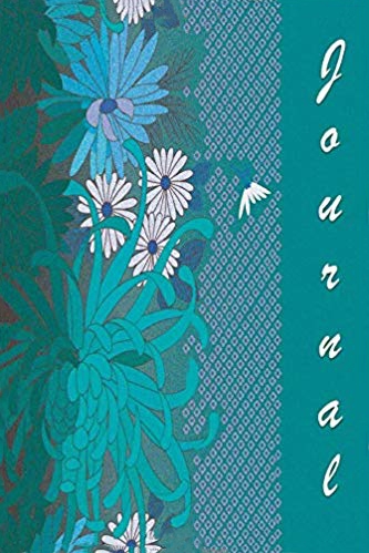Teal blue softcover notebook with flowers on the cover and white text that says journal