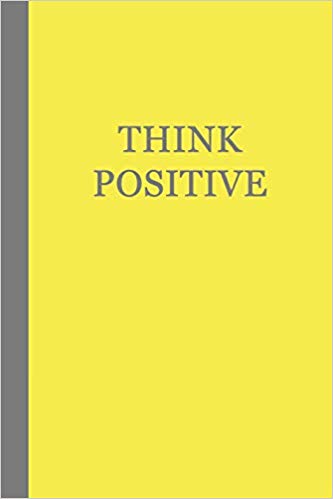 Grey journal with yellow text that says THINK POSITIVE