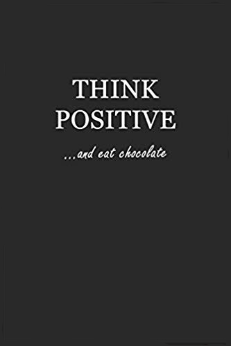 Softcover black writing journal with white text that says: Think Positive... and eat chocolate