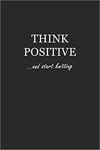 Softcover black writing journal with white text that says: Think Positive... and start knitting