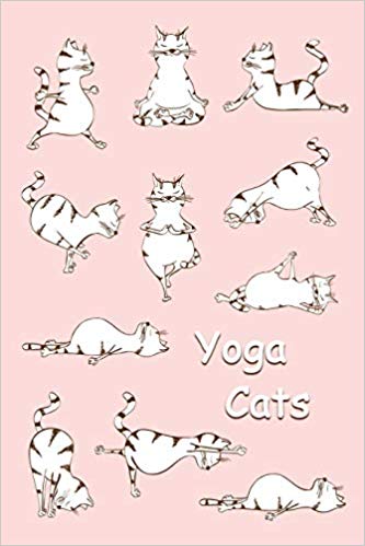 Pink and white journal with cats doing yoga on the cover. White text says yoga cats.